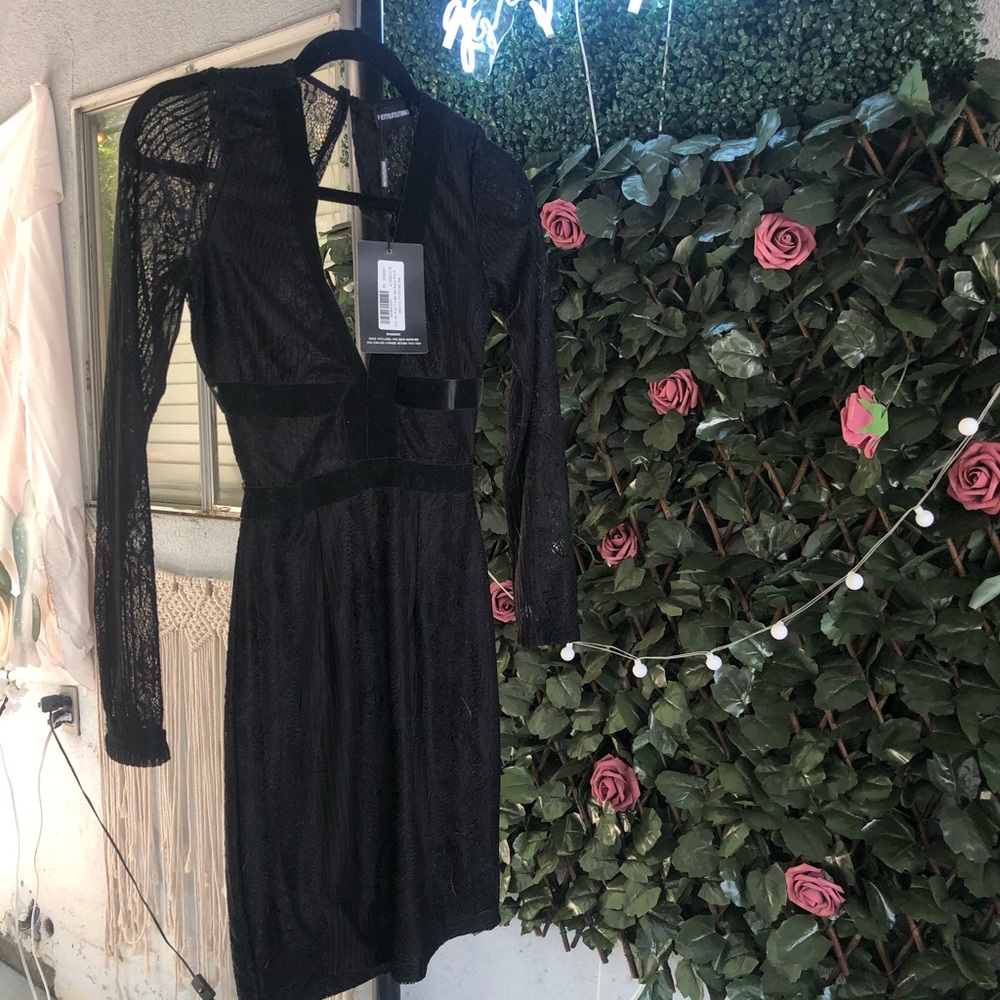 Pretty Little thing black dress. Open back. Lace